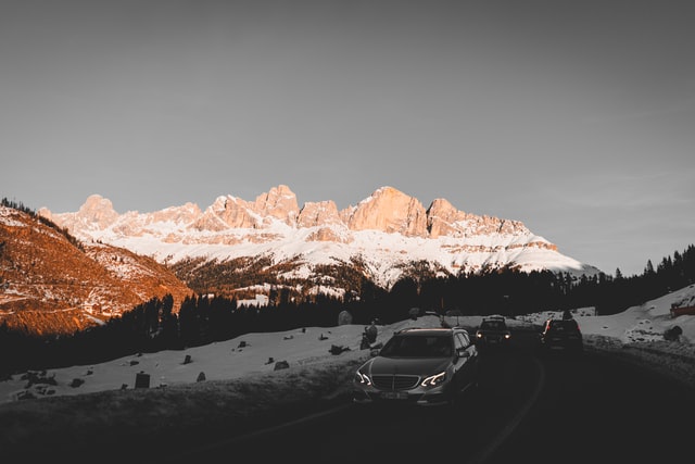 Car driving through the Dolomites mountain region