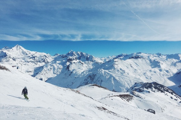 Snowboarder looking down a slope in Tignes