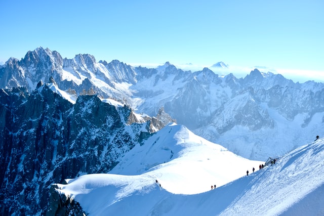 Skiers on a mountain ridge in Chamonix