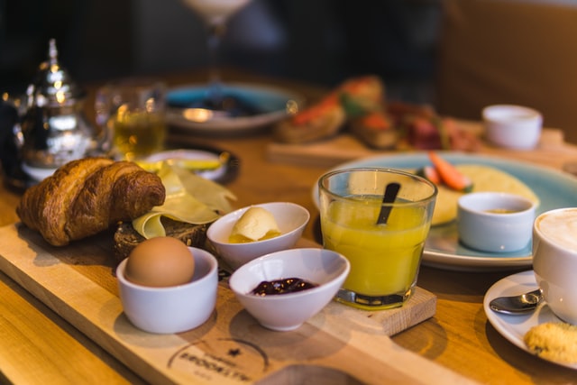 A selection of breakfast food on a wooden table