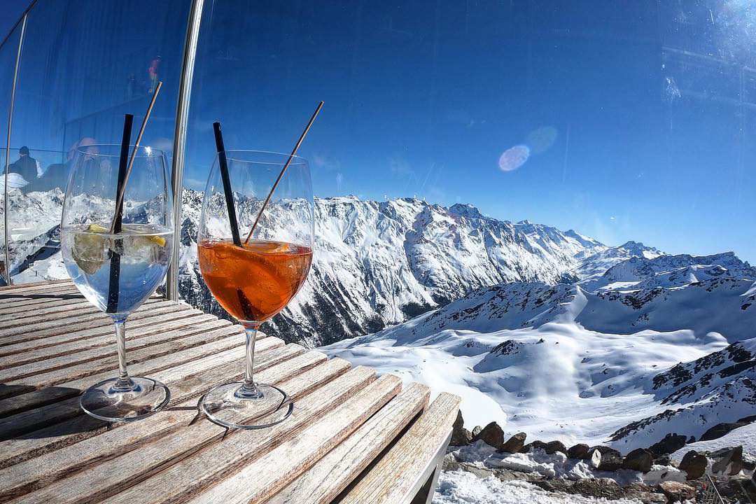 A Hugo and Aperol cocktail on the balcony on Ice Q bar in Solden