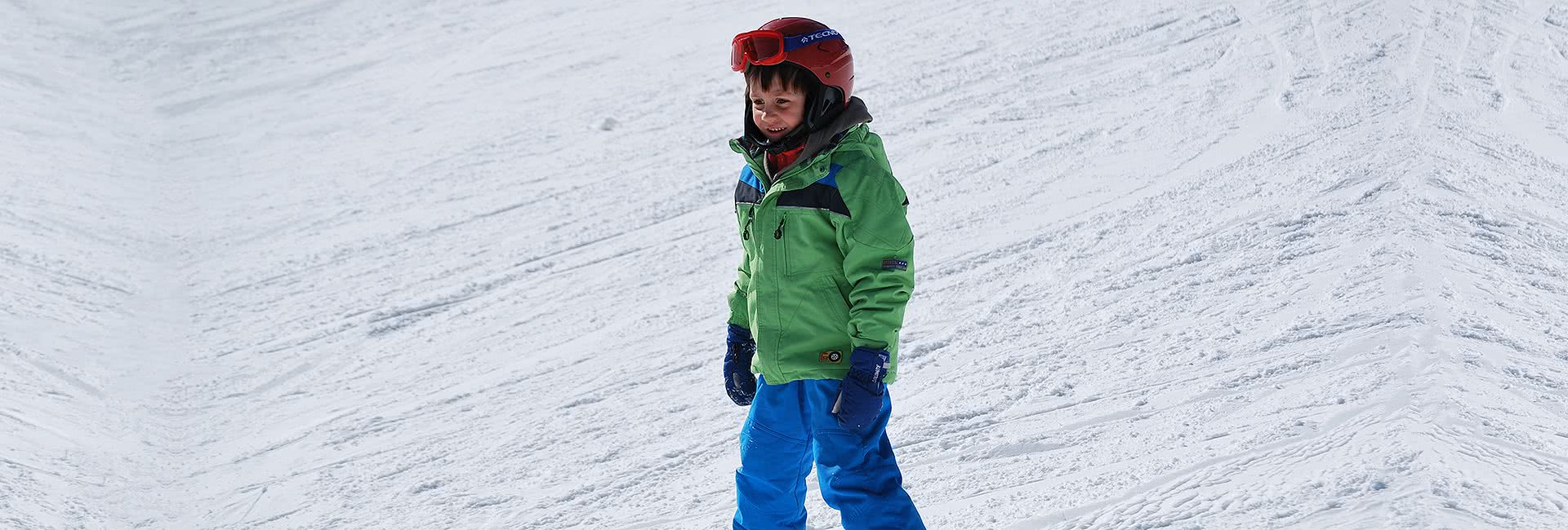 child skiing bled