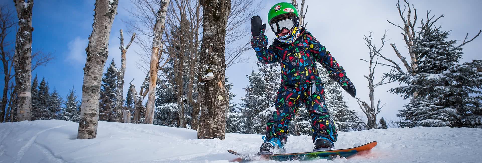 child snowboarding