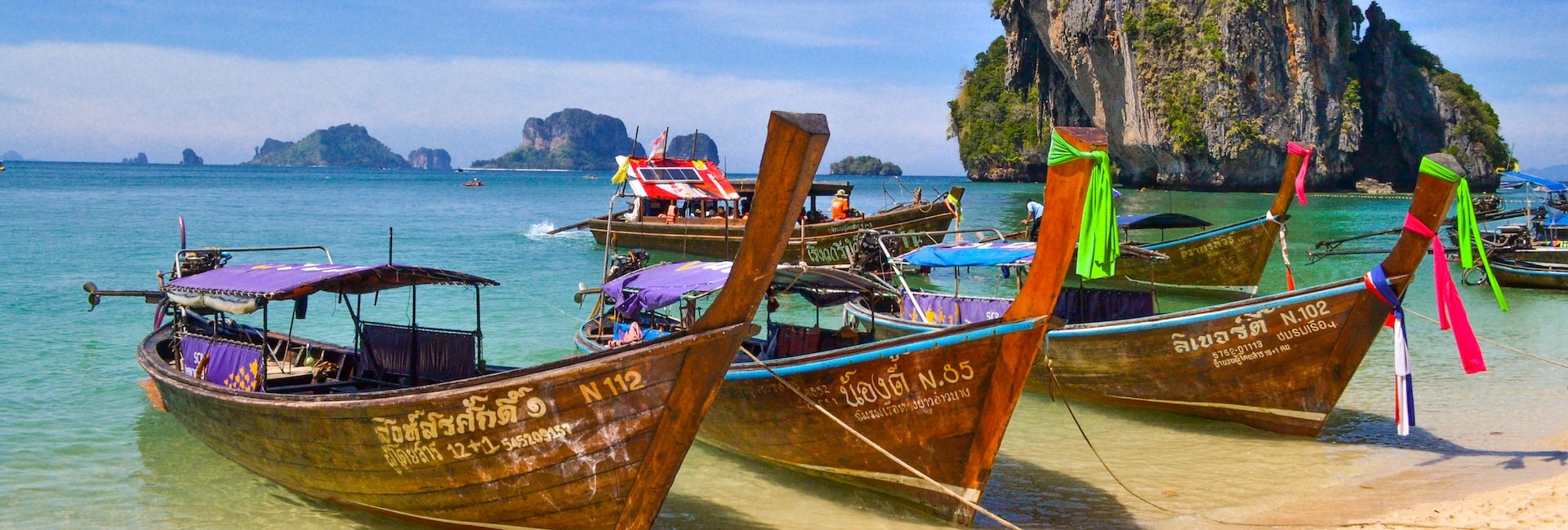 Wooden boats docked up on a breath-taking bay