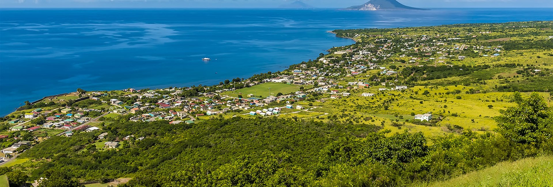View from hill of a coastal town on a tropical island 