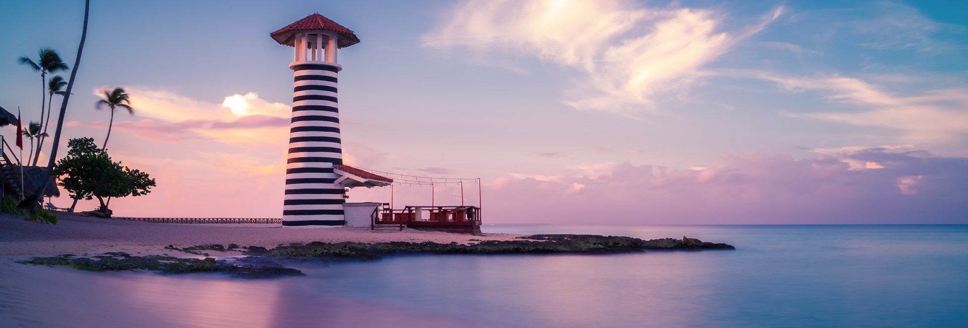 Purple sunset at Bayahibe beach lighthouse in La Romana