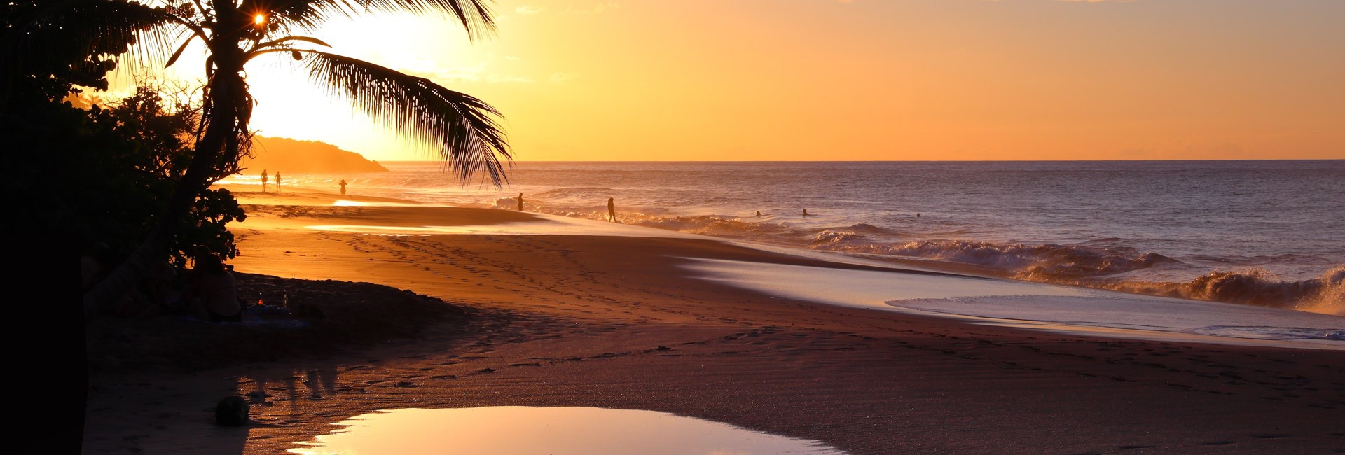 Orange sunset at a sandy tropical beach in Guadeloupe