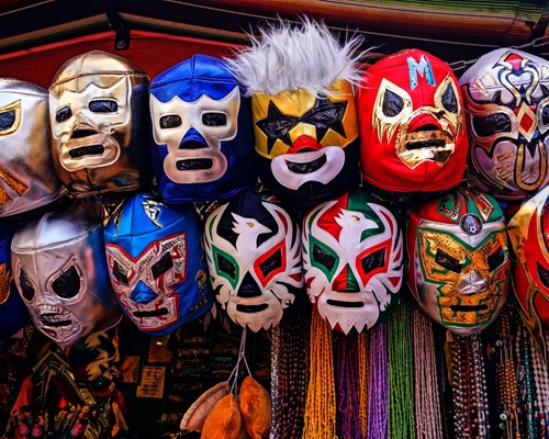 Colourful lucha libre Mexican masks on a market stall 