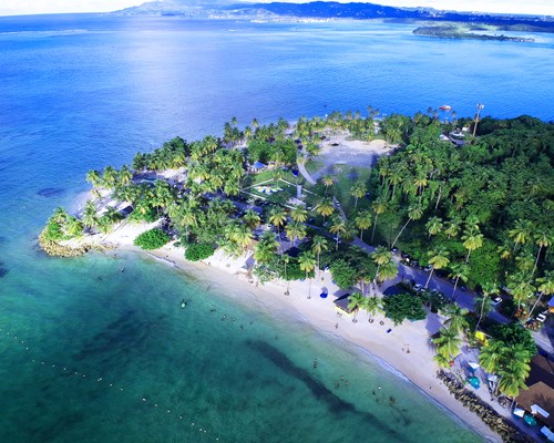 Aerial view of a holiday resort on a tropical white beach