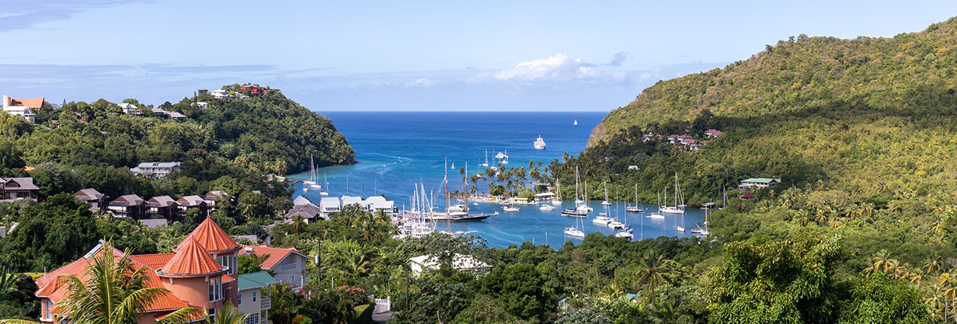 View of boats in Marigot Bay and the surrounding hills of forests