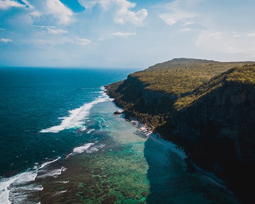 Aerial view of headland and cliffs on a tropical island