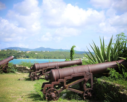 Old cannons at Fort James looking out to the sea in Antigua