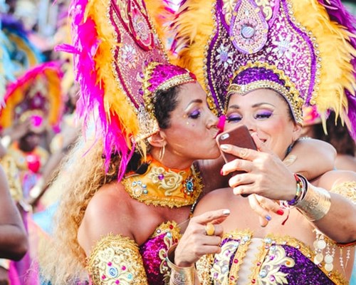 2 women in colourful festival costumes
