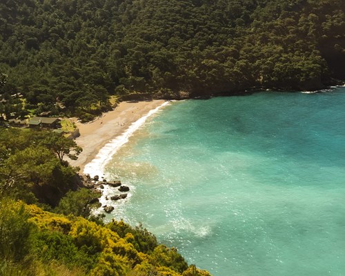 Kabak Beach in Olu Deniz surrounded by green landscapes