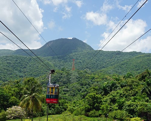 Puerto Plata Cable Car moving up lush mountain 