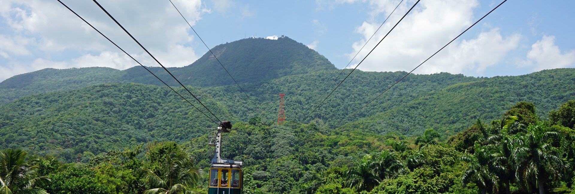 Puerto Plata Cable Car moving up lush mountain
