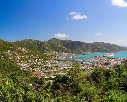 Mountain view looking out to colourful buildings and green mountains - Road Town, Tortola 