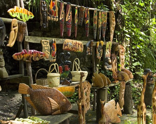 Wooden sculptures and local goods on a gift stall in Jamaica