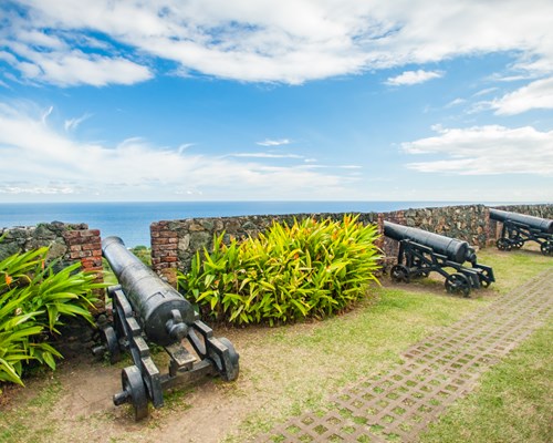 Cannons at the wall at Fort King George in Tobago
