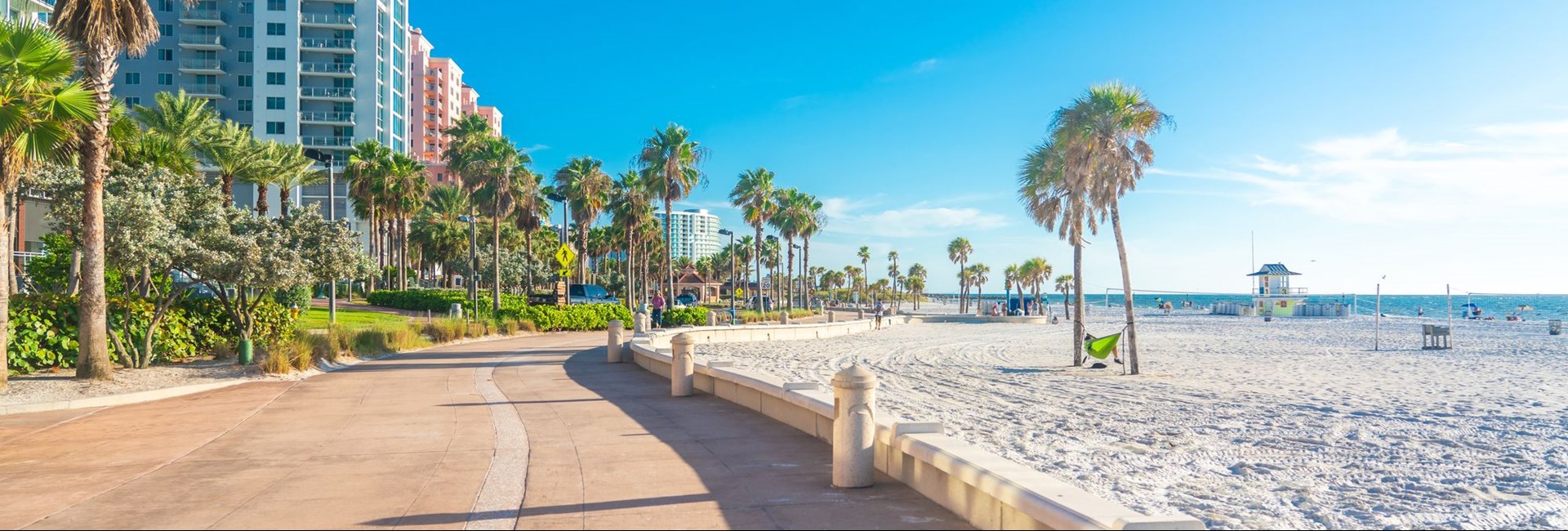 Promenade next to a beautiful white sand beach in Florida 