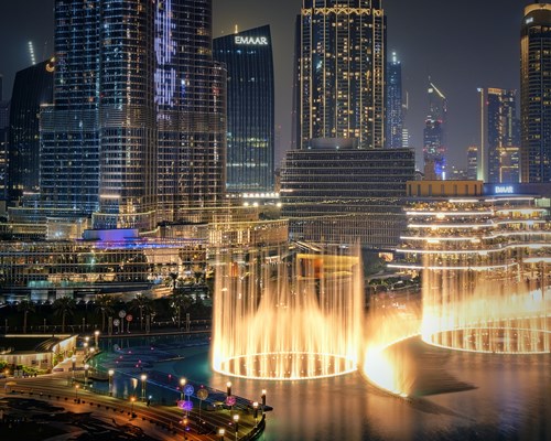 The city and the Dubai Mall with fountains at night