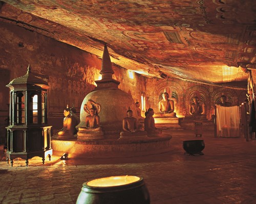 Buddhist statues walls covered in painted murals