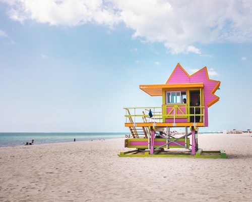 A colourful life guard shack on a beach