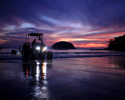 Tractor on Kata Beach at night